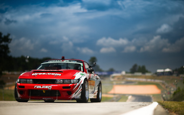 Red car white stripe tiltshift free wallpaper - medium preview image