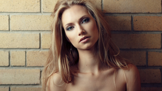 Woman longhair brickwall portrait photorealistic free wallpaper - medium preview image