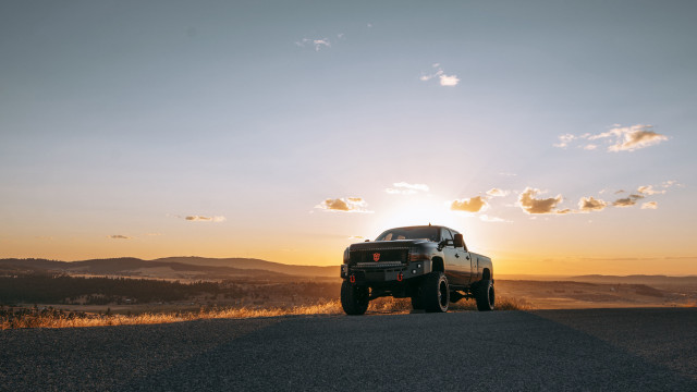 Truck sunset clouds mountains ocean free wallpaper - medium preview image