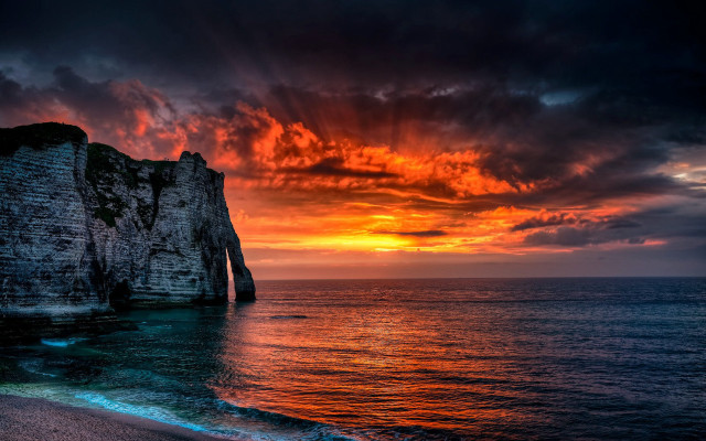 Sunset ocean rock formation clouds free wallpaper - medium preview image