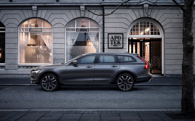 Volvo city street night storefront free wallpaper - medium preview image