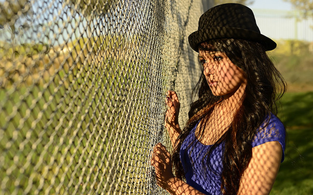 Woman fence hat greenfield portrait free wallpaper - medium preview image