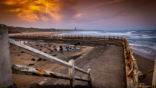 Dusk beach fence lighthouse water free wallpaper - medium preview image
