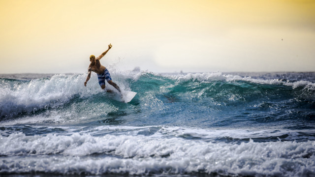 Man surfing wave ocean sky free wallpaper - medium preview image