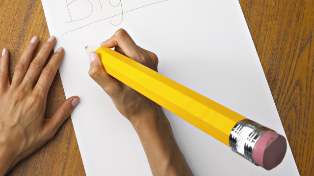 Person writing pencil yellow paper free wallpaper - medium preview image