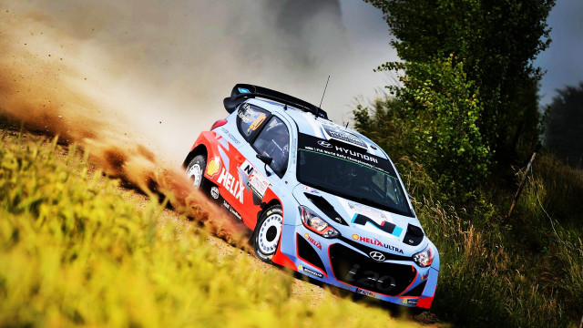 Rally car dirt road woods free wallpaper - medium preview image