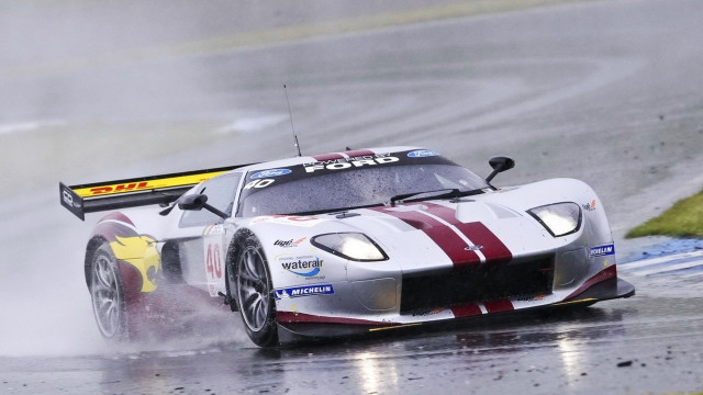 Racecar rainy track person helmet free wallpaper - medium preview image