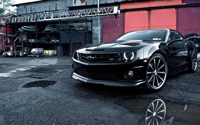 Black car red building night free wallpaper - medium preview image