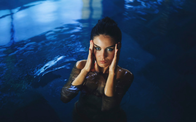 Woman wetsuit hands to face free wallpaper - medium preview image