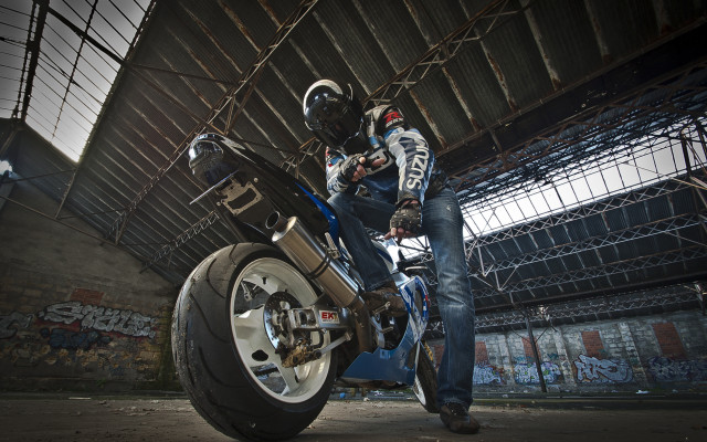 Warehouse motorcycle graffiti studio portrait free wallpaper - medium preview image