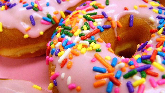Doughnut sprinkles pink background hyperrealism free wallpaper - medium preview image