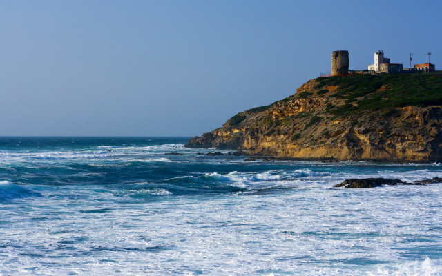Rocky cliff ocean lighthouse blue free wallpaper - medium preview image