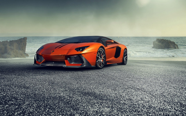 Orange sports car ocean rock free wallpaper - medium preview image