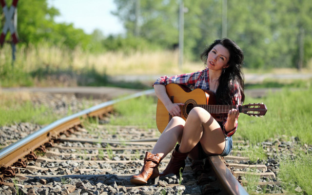 Woman sitting train track guitar free wallpaper - medium preview image