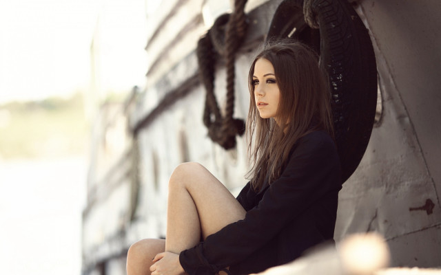 Woman sitting building crossed portrait free wallpaper - medium preview image