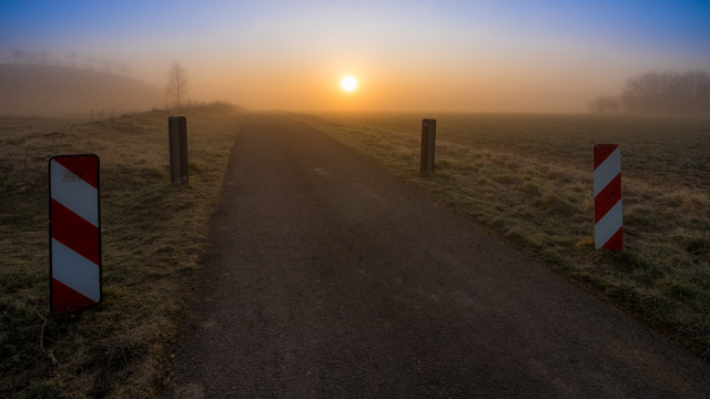 Road sign sunset foggy beach free wallpaper - medium preview image