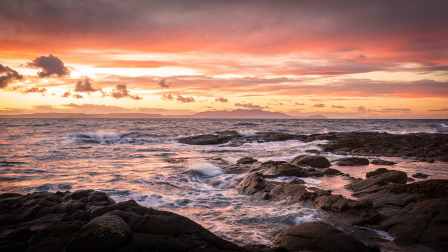 Sunset ocean rocks waves mountain free wallpaper - medium preview image