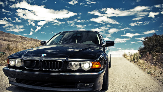 Black car dirt road blue free wallpaper - medium preview image