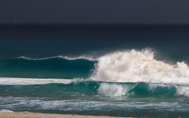 Large wave breaking beach surfers free wallpaper - medium preview image