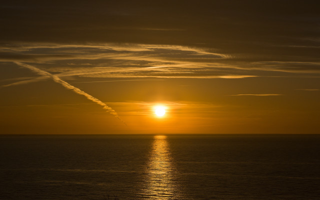 Sunset ocean contrail boat lensflare free wallpaper - medium preview image