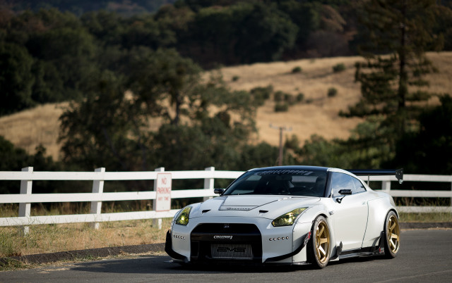 White sports car driving road #2 free wallpaper - medium preview image