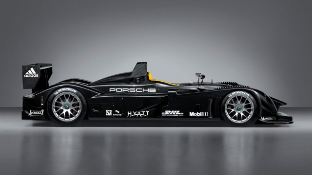 Racecar yellow stripe black background free wallpaper - medium preview image