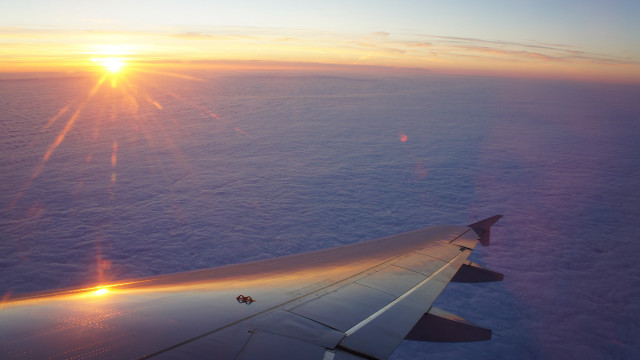 Sunset ocean clouds plane view free wallpaper - medium preview image