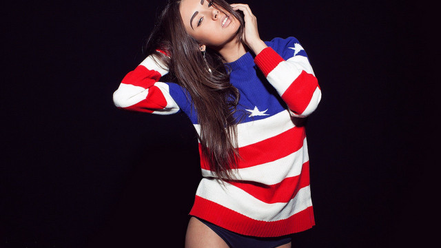 Woman flag sweater dark background free wallpaper - medium preview image