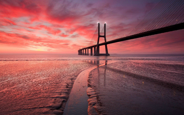 Sunset bridge beach water mountains free wallpaper - medium preview image
