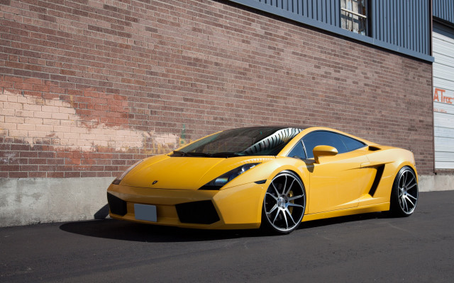 Yellow sports car brick wall #2 free wallpaper - medium preview image