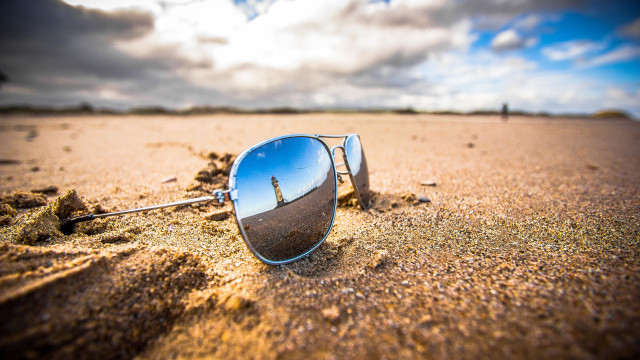 Sunglasses beach sand clouds ocean free wallpaper - medium preview image