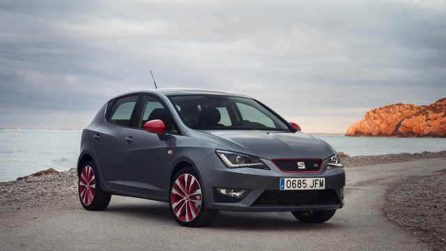 Grey car ocean rocks beach free wallpaper - medium preview image