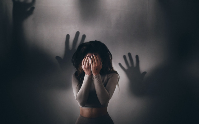 Woman hiding face shadow hands free wallpaper - medium preview image