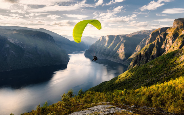 Paragliding lake mountains trees yellow free wallpaper - medium preview image