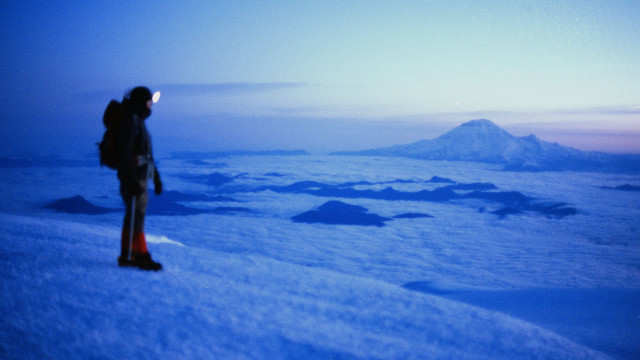 Man snowy mountain slope dusk free wallpaper - medium preview image