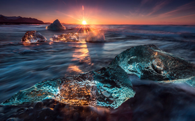Sunset ocean rocks formation sunlight free wallpaper - medium preview image