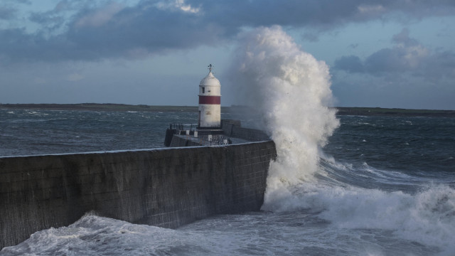 Lighthouse wave ocean concrete wall free wallpaper - medium preview image