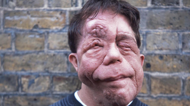 Man wrinkles brick wall portrait free wallpaper - medium preview image