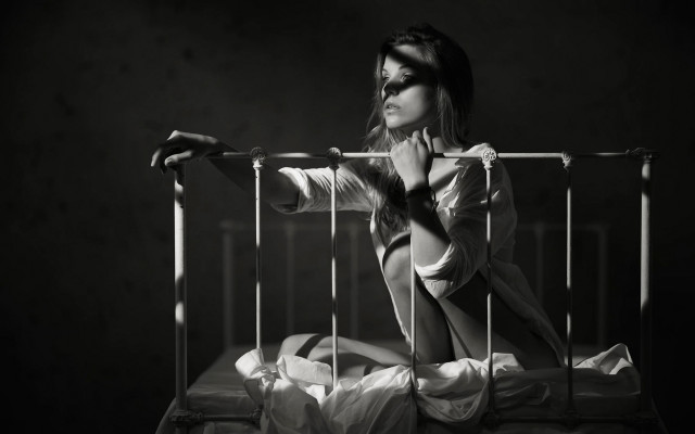 Woman sitting bed cage black free wallpaper - medium preview image