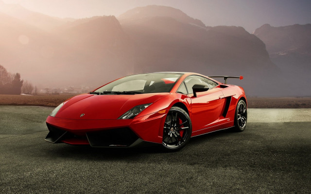 Red sports car mountains foggy free wallpaper - medium preview image