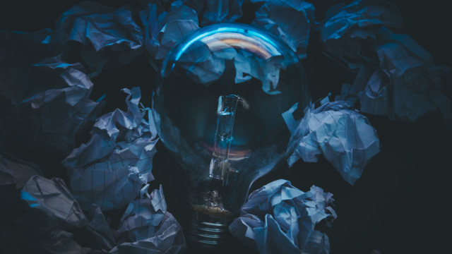 Person lightbulb crumpledpaper bluelight blackbackground free wallpaper - medium preview image