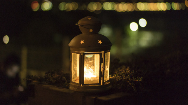 Lit lantern cement block night free wallpaper - medium preview image