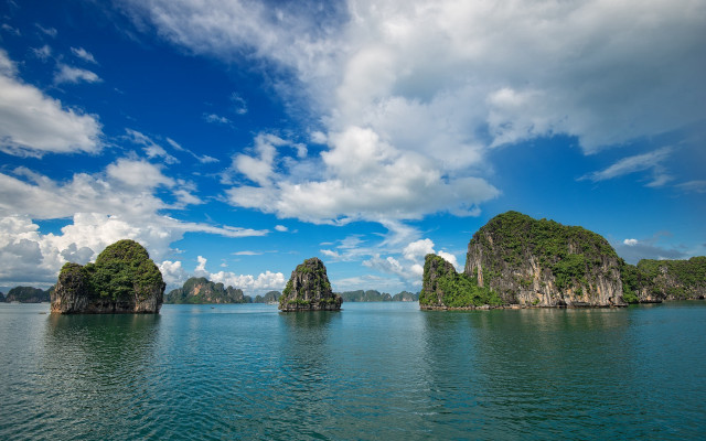 Rocky island reflection clouds sky free wallpaper - medium preview image