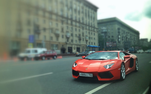 Red sports car city street free wallpaper - medium preview image
