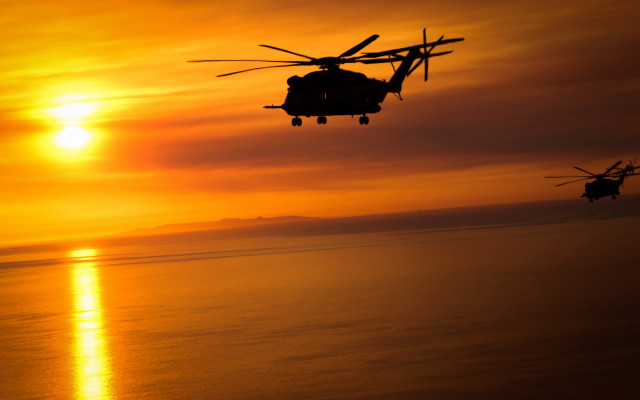 Helicopter over ocean sunset orange free wallpaper - medium preview image