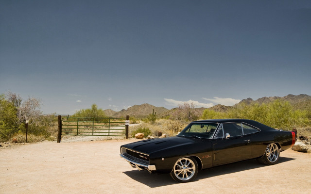Black car desert mountains gate free wallpaper - medium preview image
