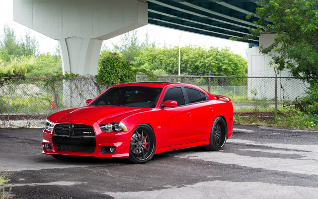 Red car parked under bridge free wallpaper - medium preview image