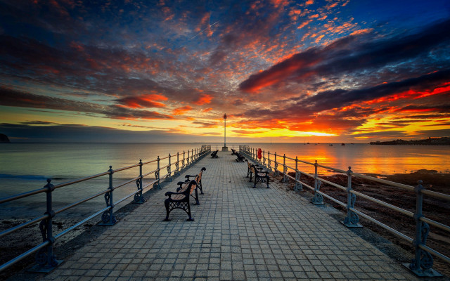 Sunset pier benches clouds water free wallpaper - medium preview image