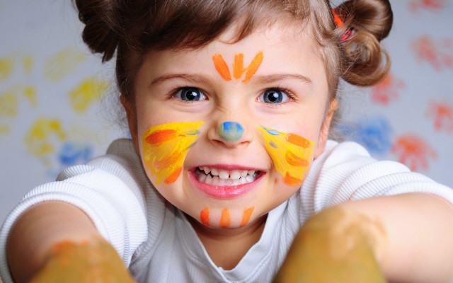 Smiling girl painted face blue free wallpaper - medium preview image