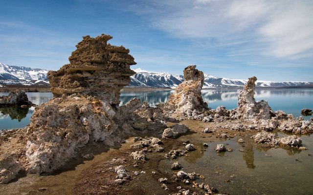 Rocky shore mountains snow water free wallpaper - medium preview image